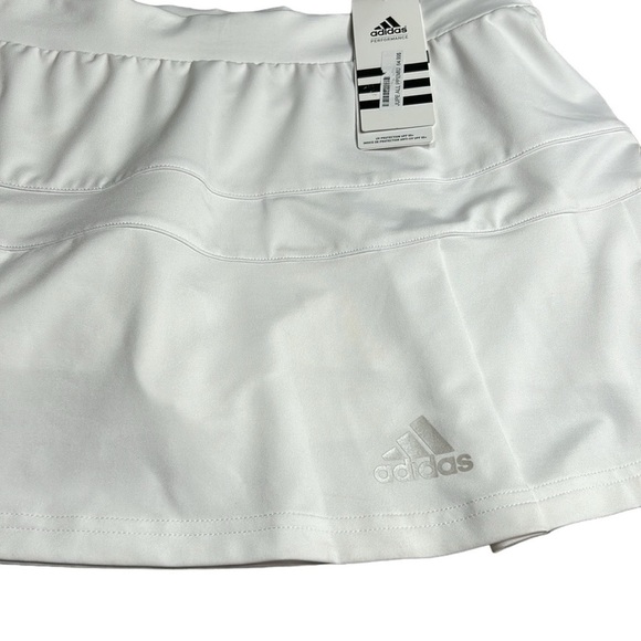 ADIDAS white skort with pleats on the bottom  half . Then two horizontal bands. - Picture 2 of 11